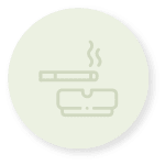 Cercle vert clair contenant l'icône d'une cigarette et un cendrier